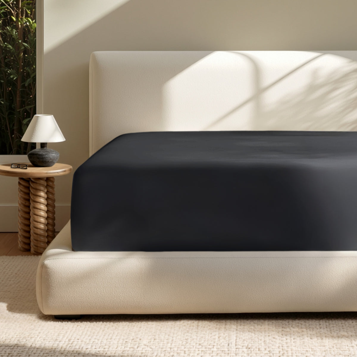 A deep pocket mattress with a fitted sheet on it