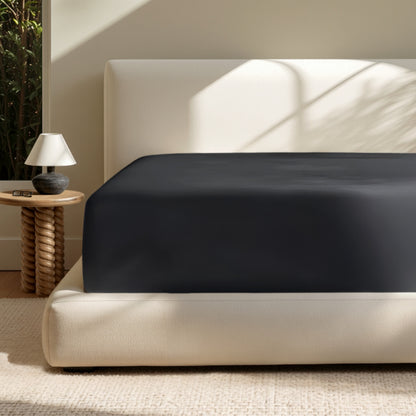 A deep pocket mattress with a fitted sheet on it