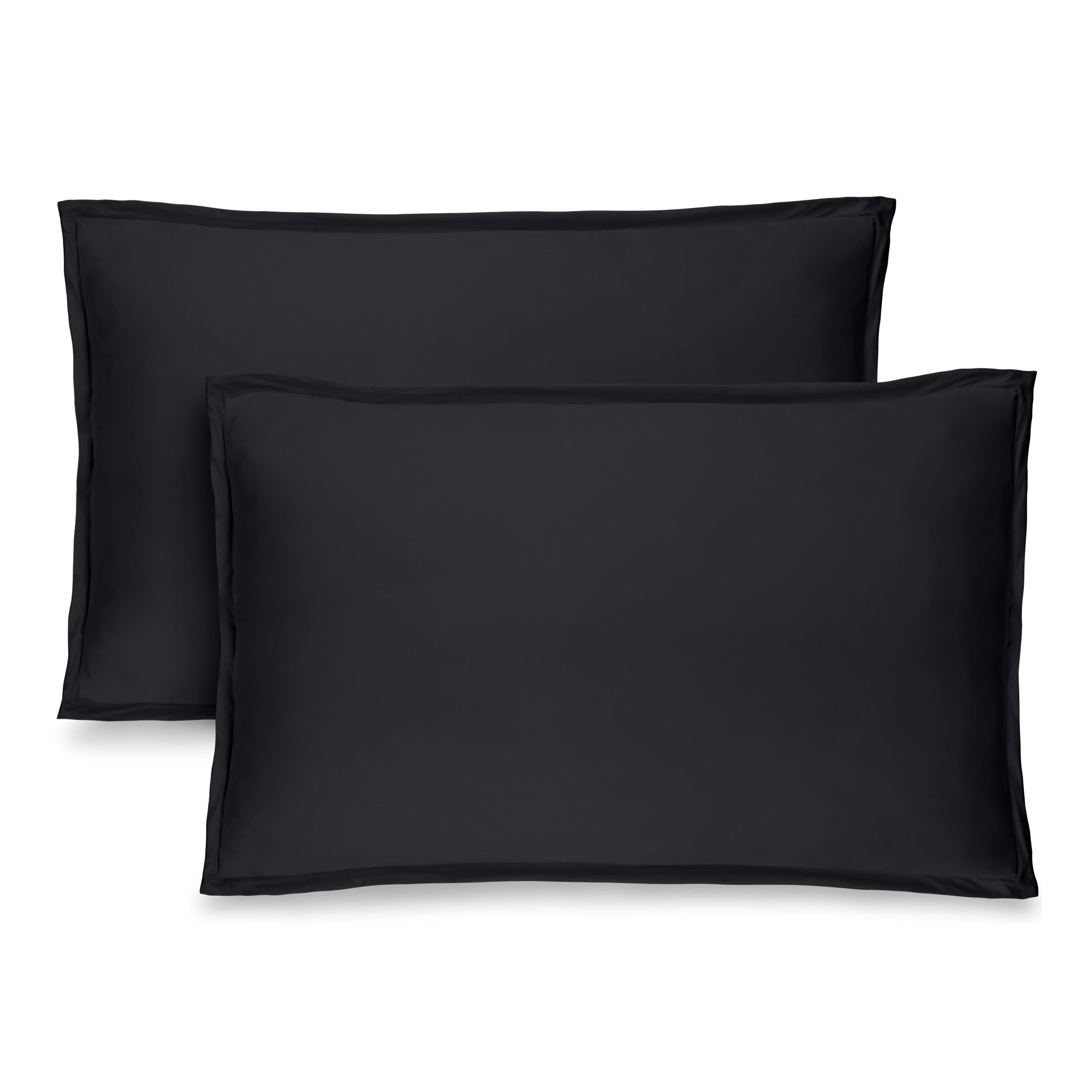 Two black pillow shams on pillows standing up with one behind the other