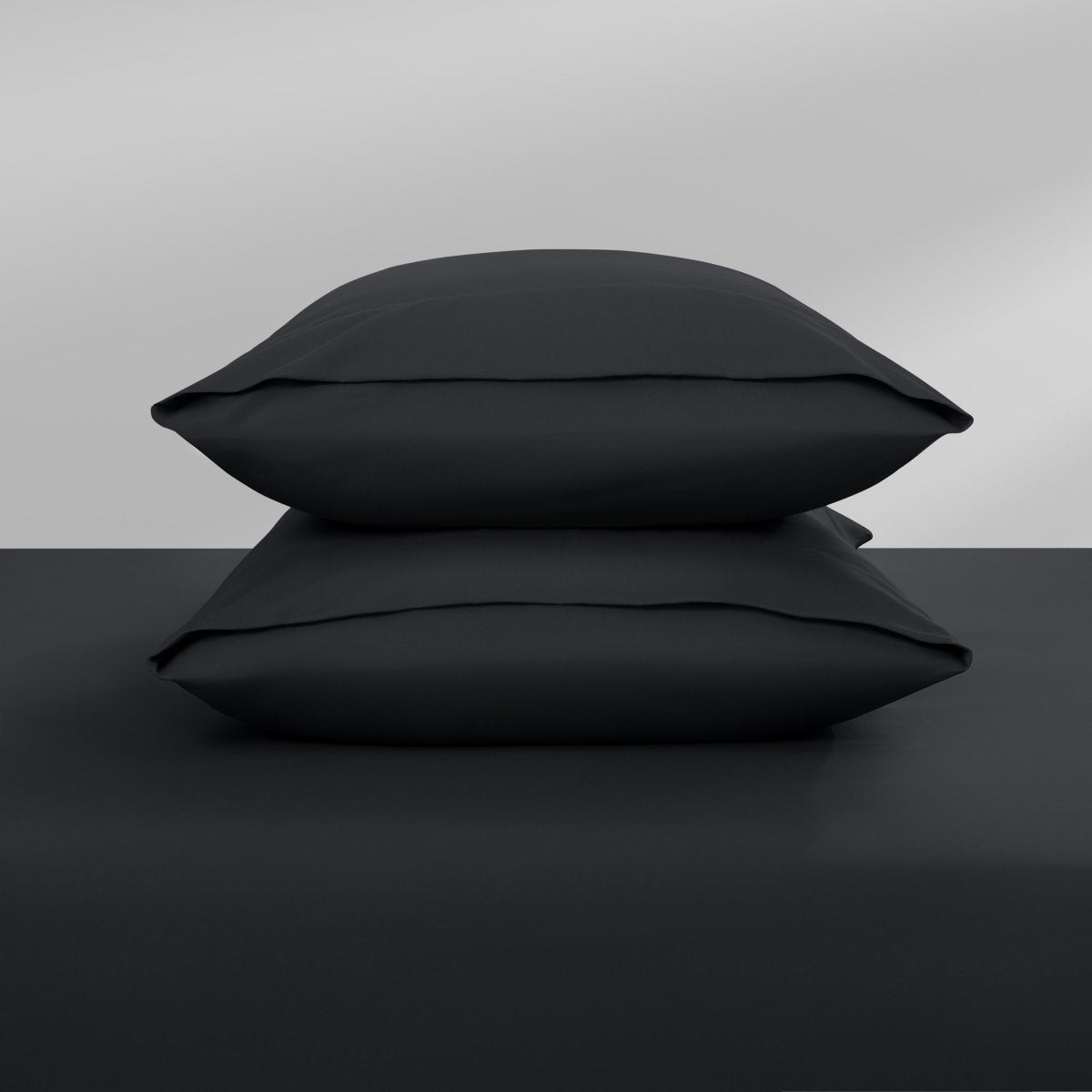 Two pillowcases on top of a bed