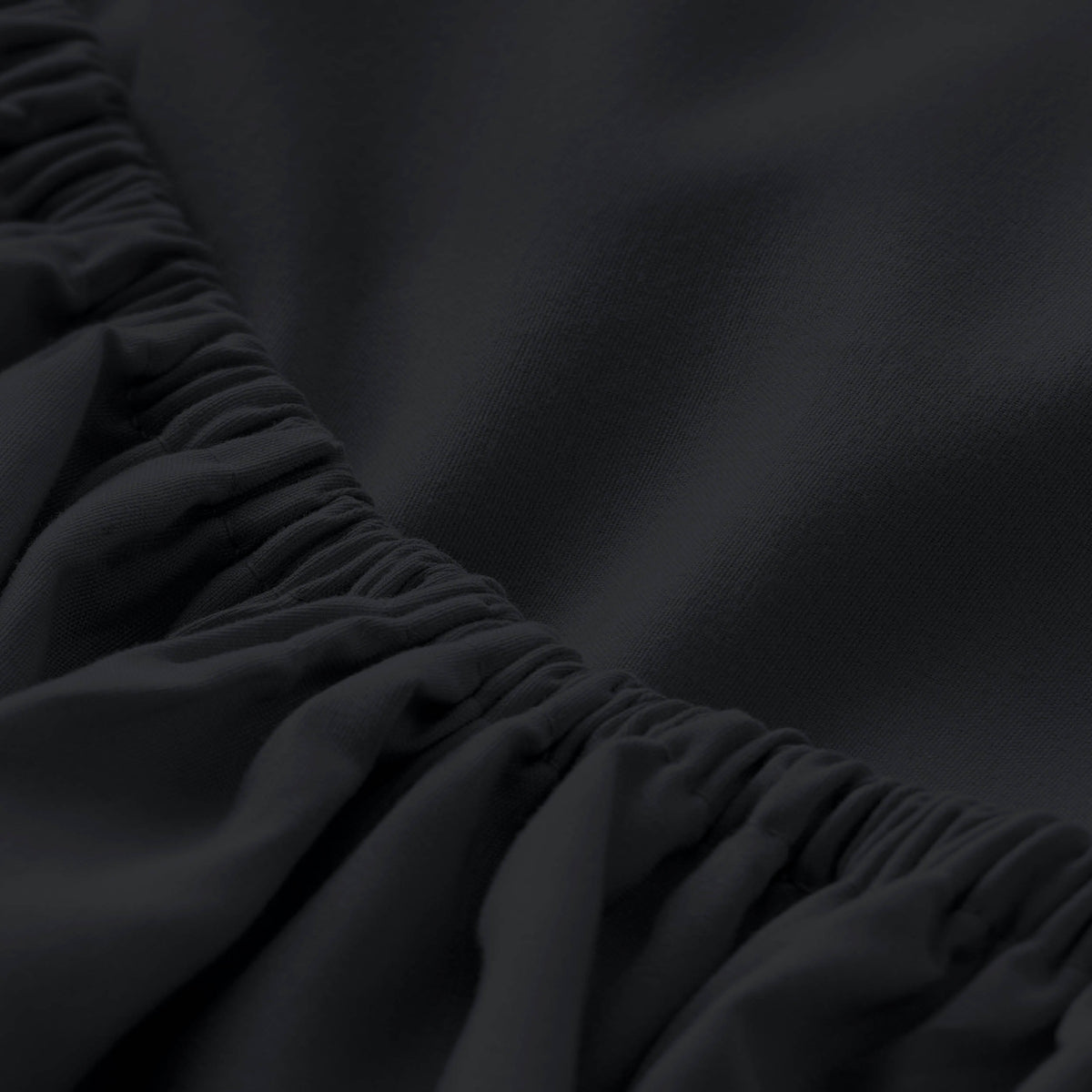 Close-up of fitted sheet with all around elastic