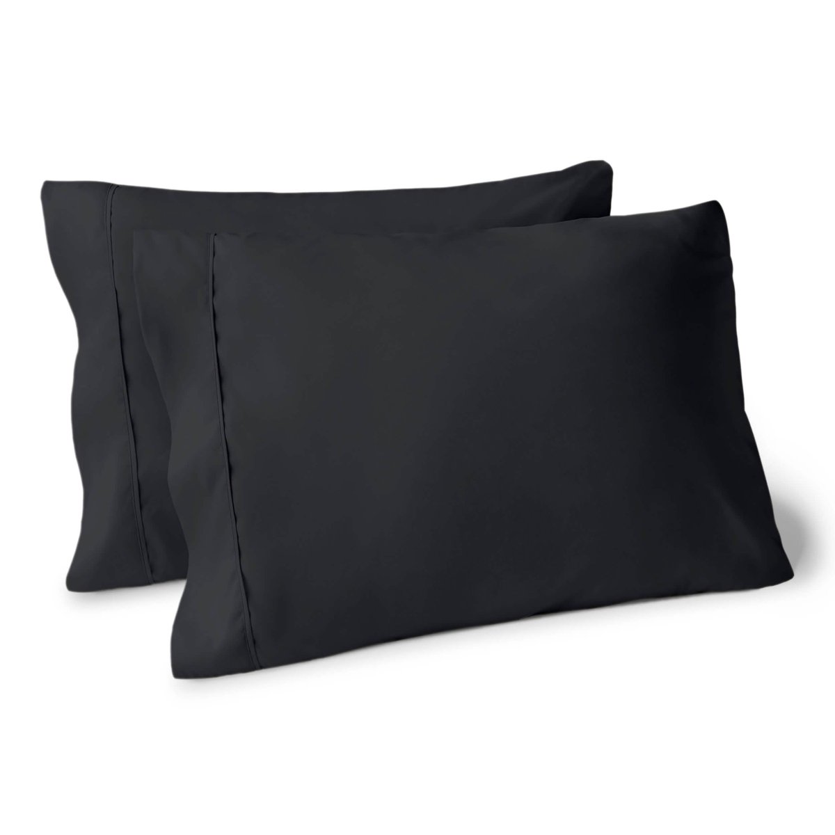 Two pillows on a white background with pillowcases on them