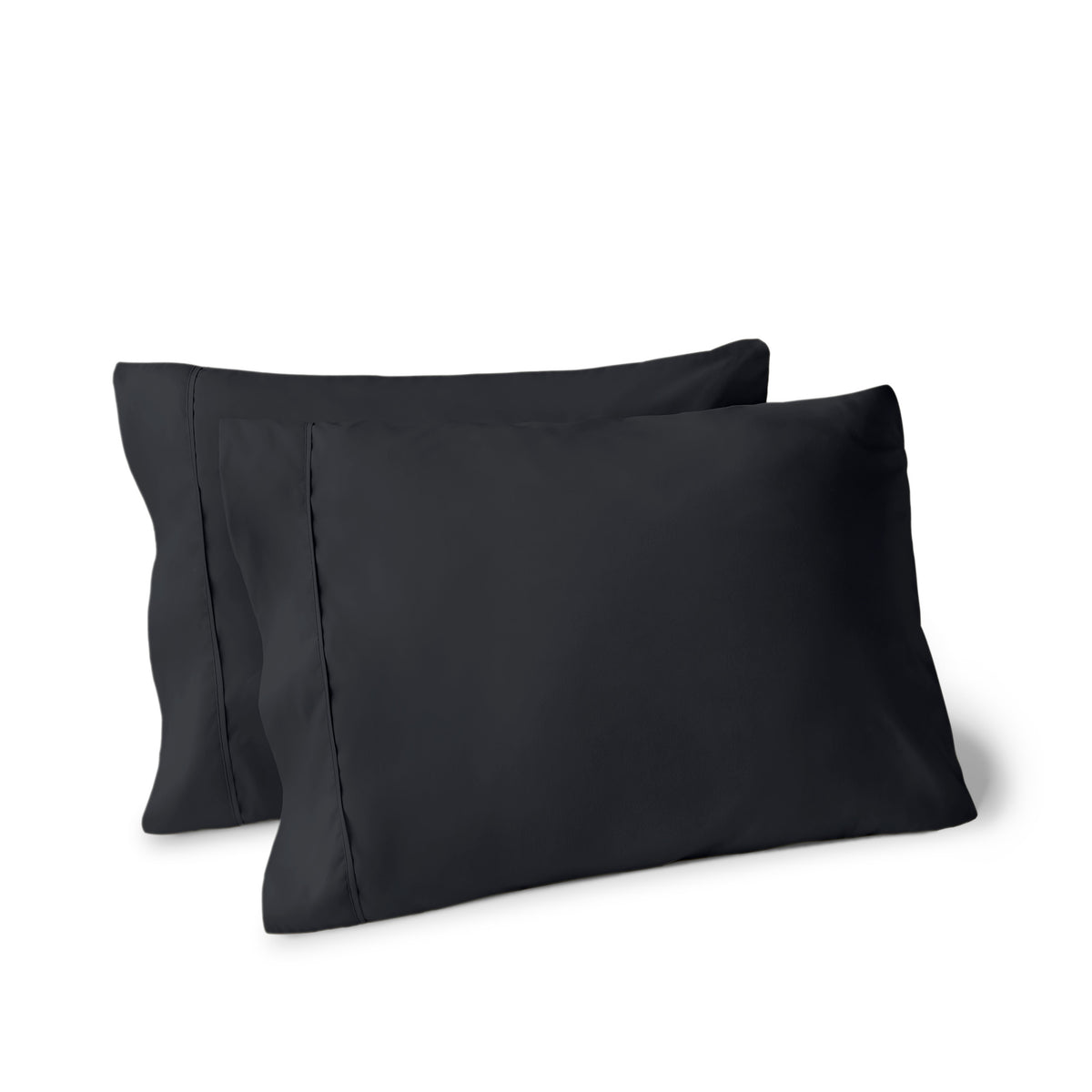 Two pillows on a white background with pillowcases on them