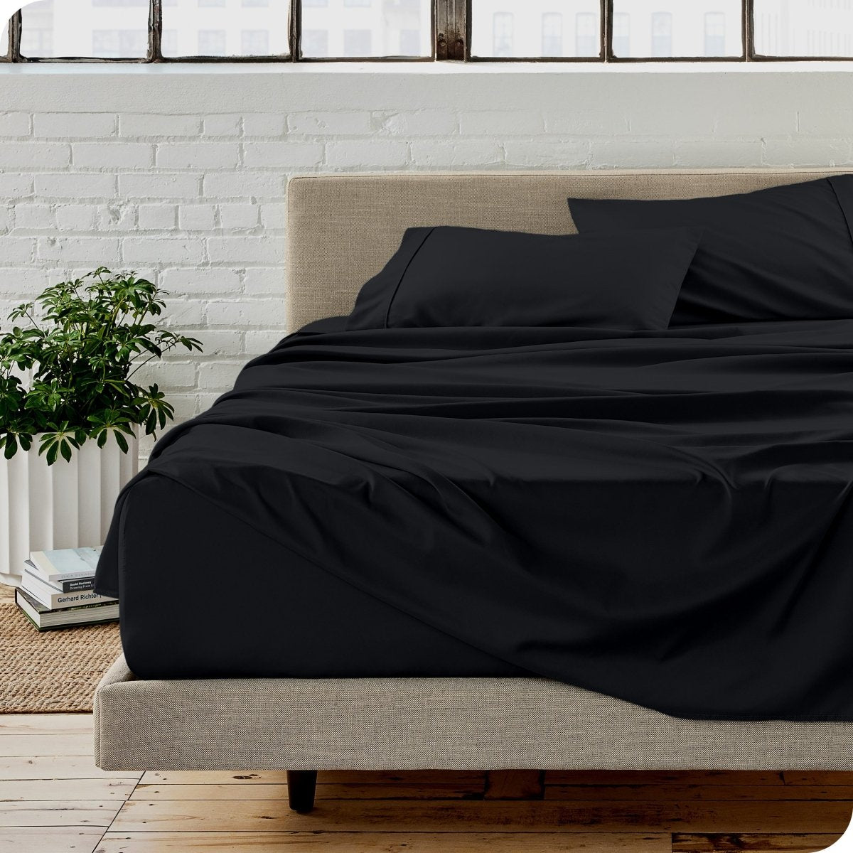A modern bedroom with microfiber sheets on the mattress