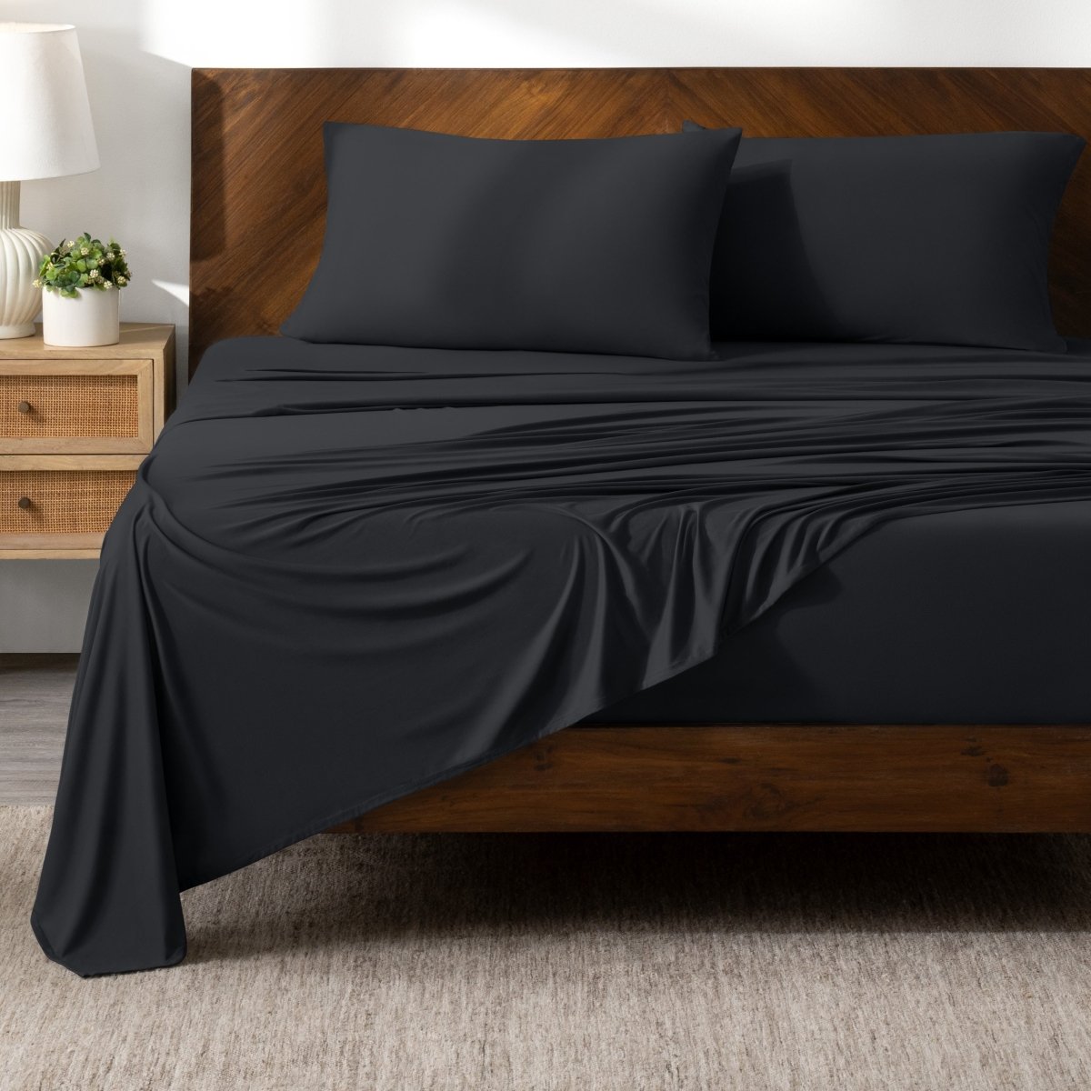 Bed sheets on a wooden bed in a bedroom setting