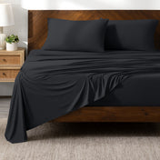 Bed sheets on a wooden bed in a bedroom setting