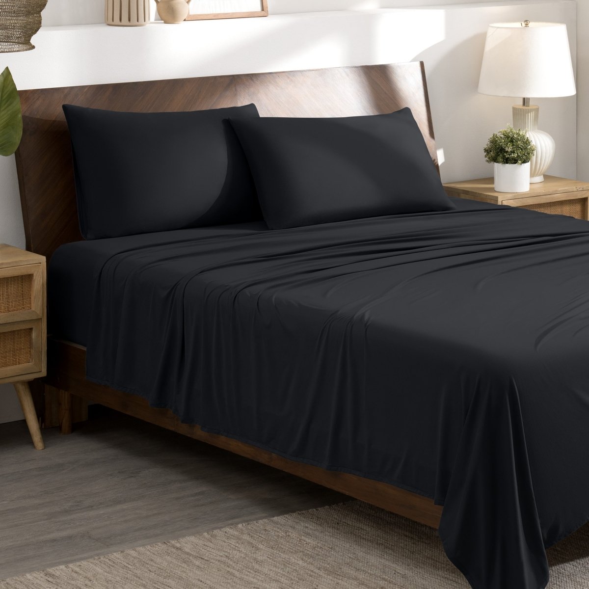Bed sheets and pillows on a bed in a bedroom setting.