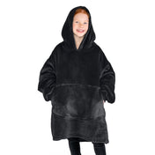 A girl is standing while wearing a microplush wearable blanket