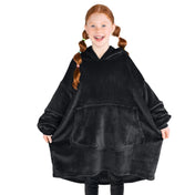 A girl has a microplush wearable blanket on