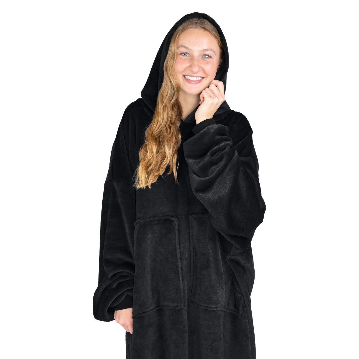 A woman has a hooded wearable blanket on