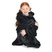 A child is sitting with wearable blanket on