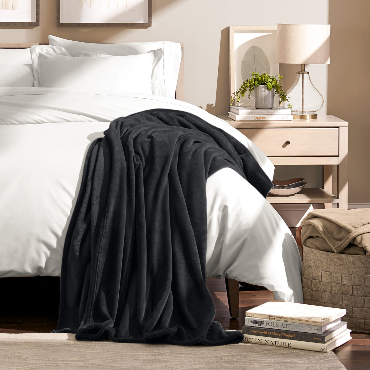 Microplush blanket draped over the corner of a bed