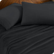 A sheet set and matching pillowcases on a bed.