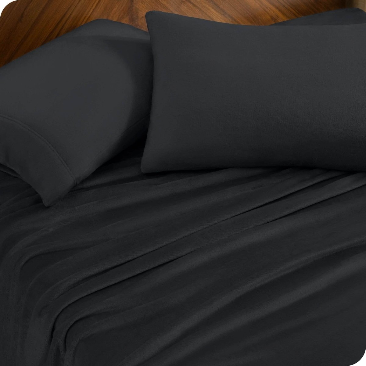 A sheet set and matching pillowcases on a bed.