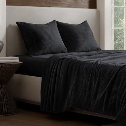 Microplush sheet set on a bed.