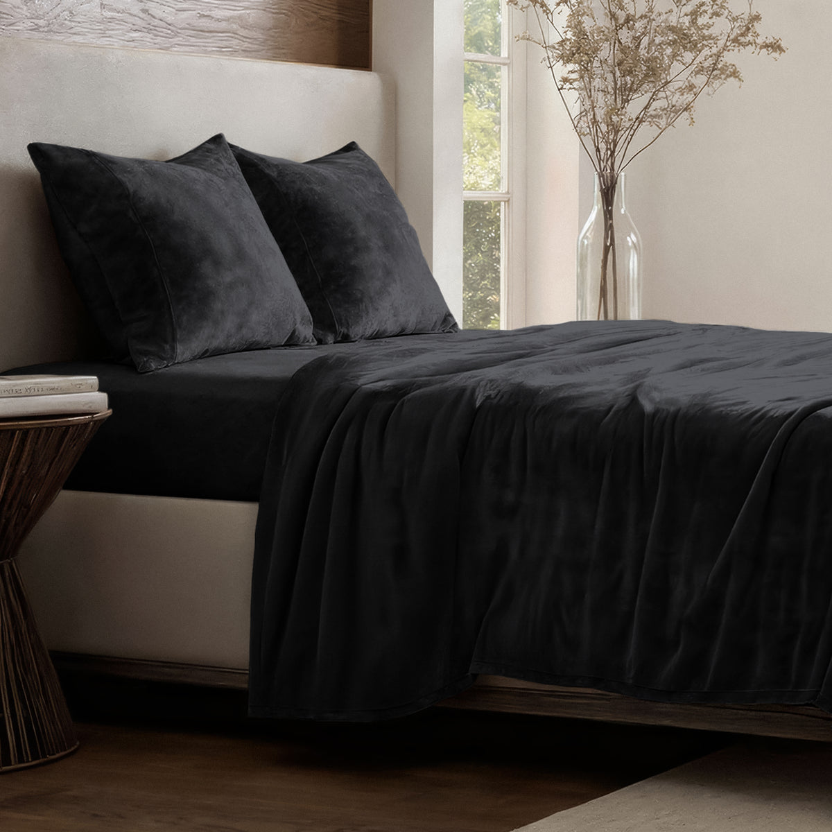 Neatly made bed in a well-lit bedroom.