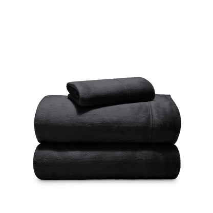 Stack of microplush sheets on a white background