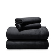 Stack of microplush sheets on a white background