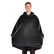 A man standing with a wearable blanket on