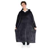 An adult with long microplush wearable blanket on
