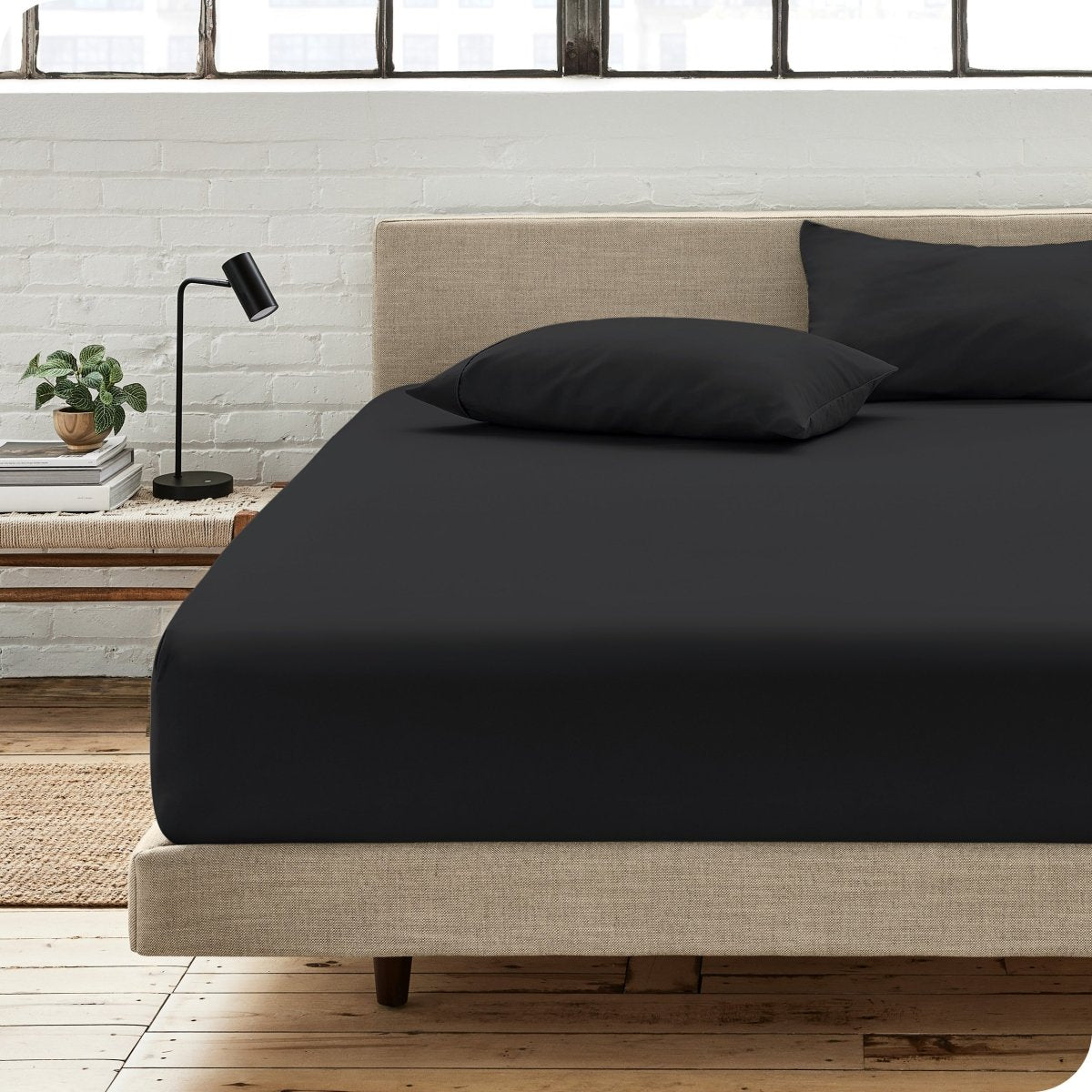 Bedroom scene with organic cotton fitted sheet and pillowcases on a bed