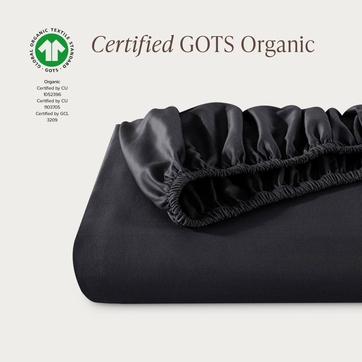 Certified GOTS Organic fitted sheet on a light gray background