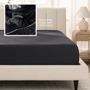 Bed with a fitted sheet next to a nightstand in a bedroom setting