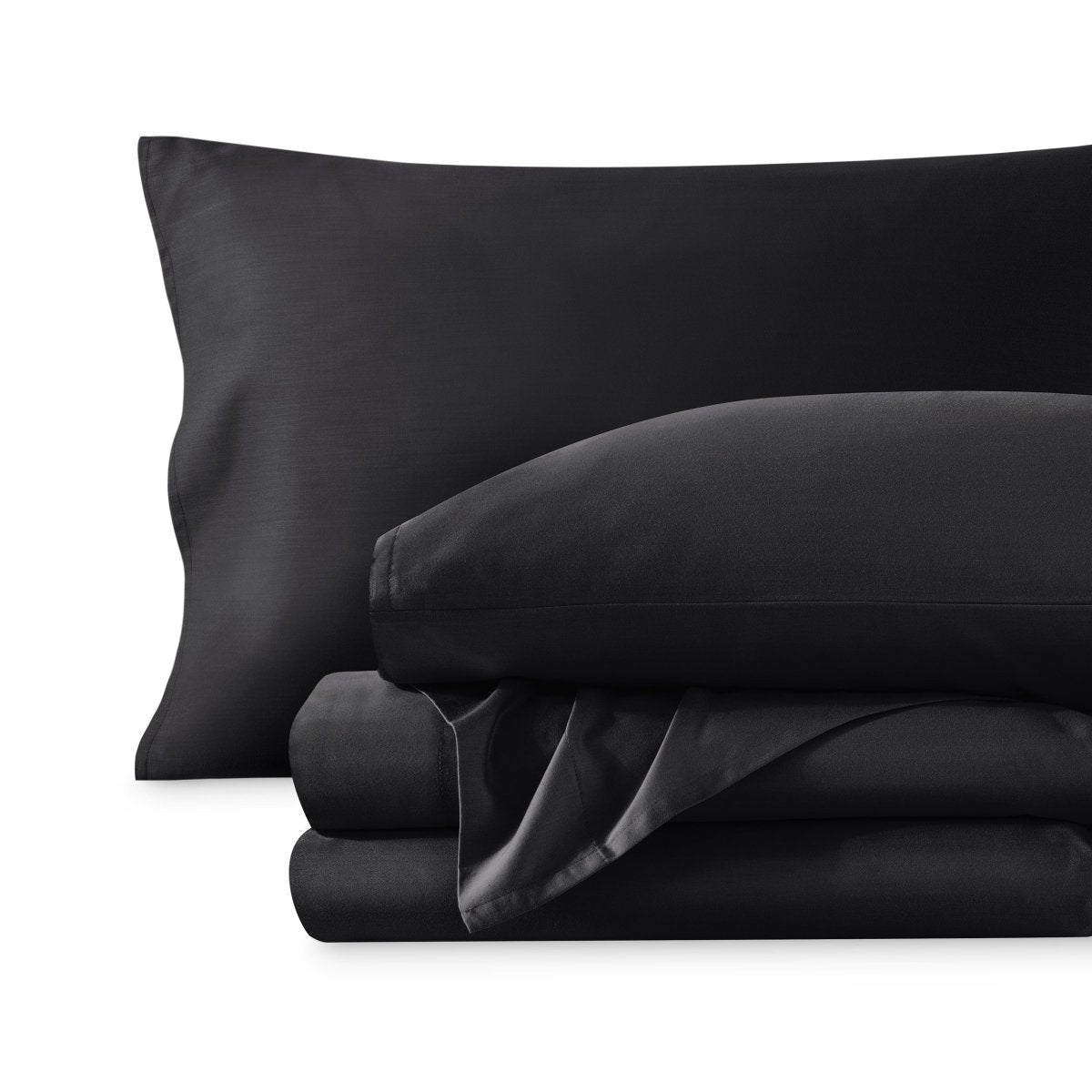 A sateen sheet set folded and stacked on a white background.