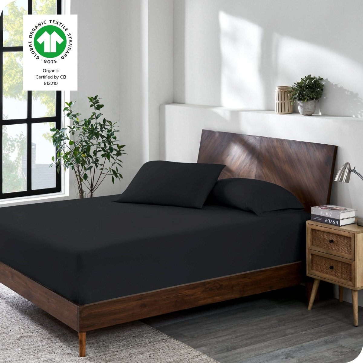 A modern bedroom with a jersey fitted sheet on the mattress with matching pillowcases