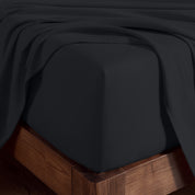 Organic cotton jersey sheet set on a wooden bed frame