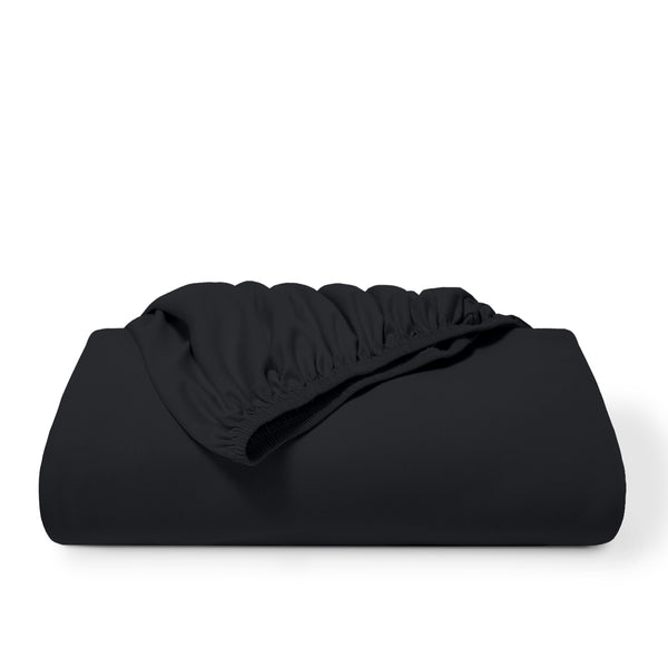 A black fitted sheet folded