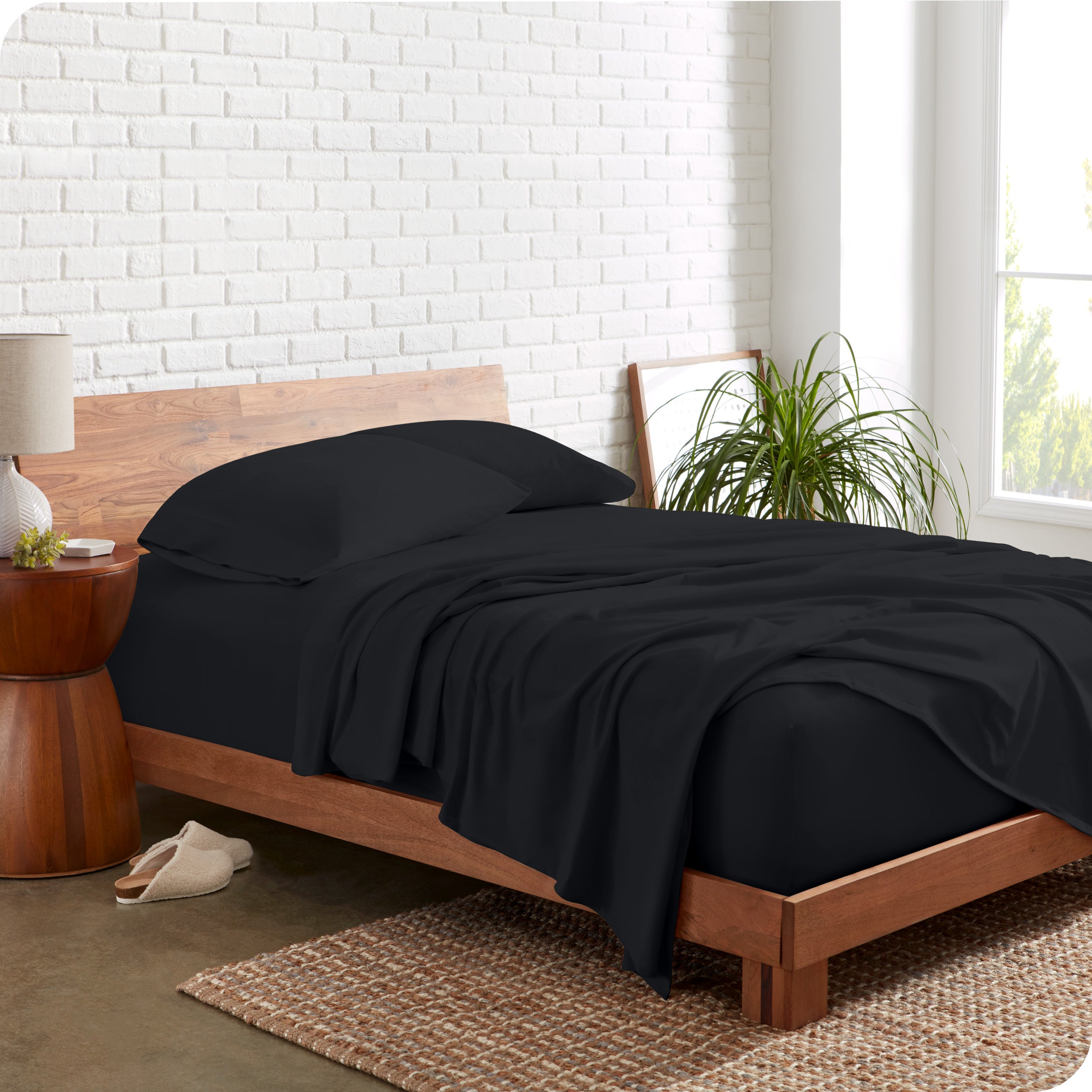 The side view of a bed made with organic cotton jersey sheets