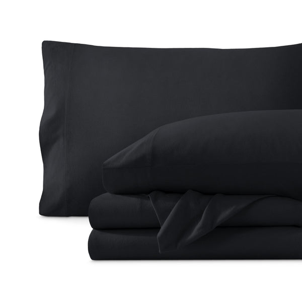 Set of organic cotton jersey sheets on a white background