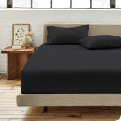 Modern bedroom with bed showing percale fitted sheet