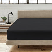 Modern bedroom with a fitted sheet which fits deep mattresses up to 15 inches