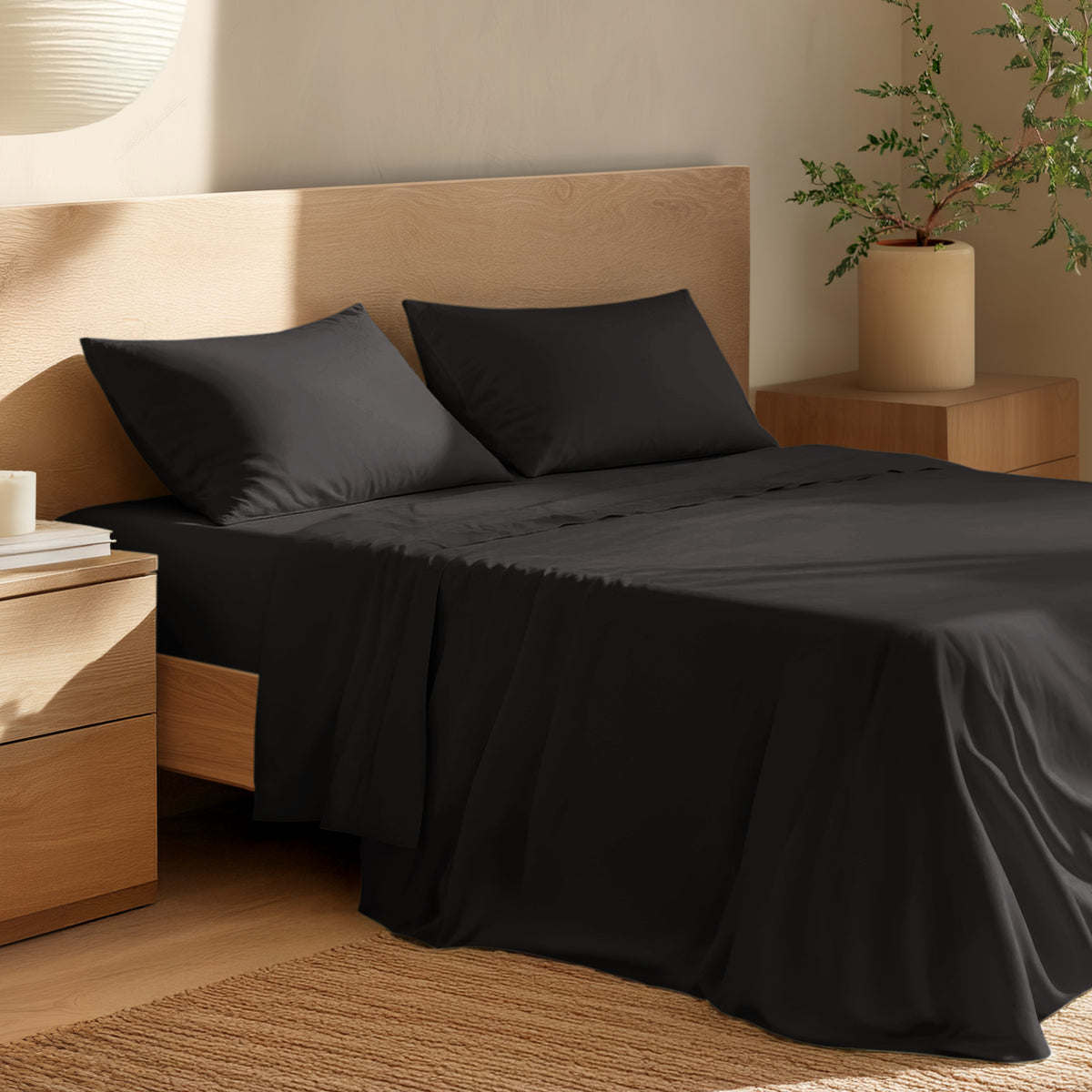 Bed with percale bedding and wooden headboard in a bedroom setting