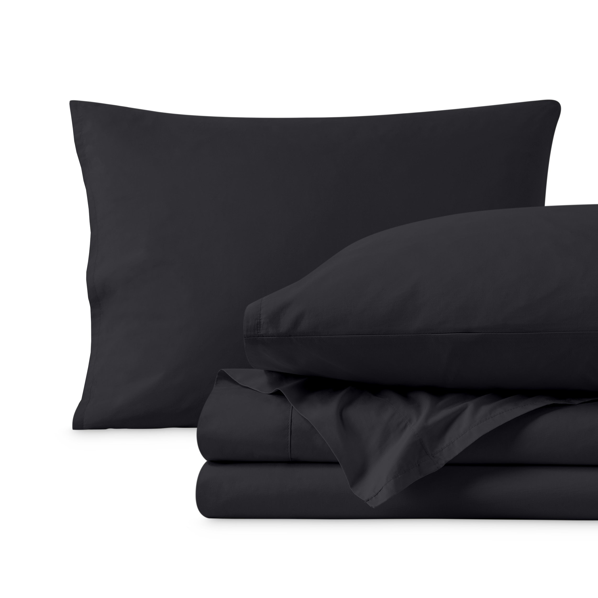 Percale sheets folded and matching pillowcases with pillows in them