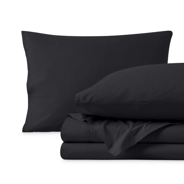 Percale sheets folded and matching pillowcases with pillows in them