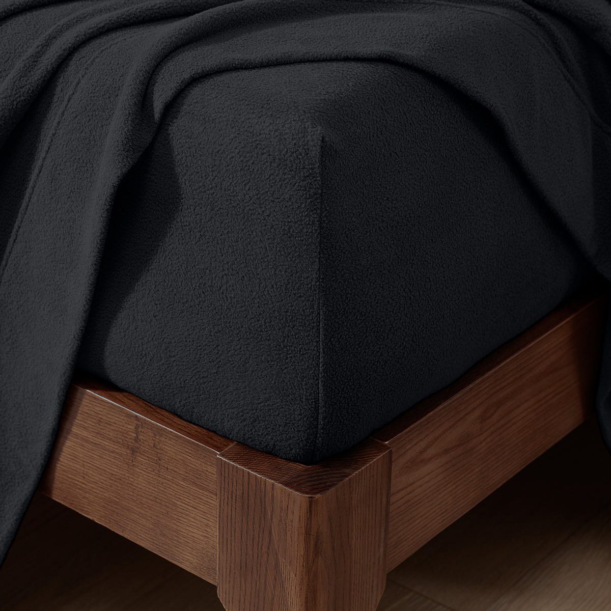 Fitted sheet on a wooden bed frame