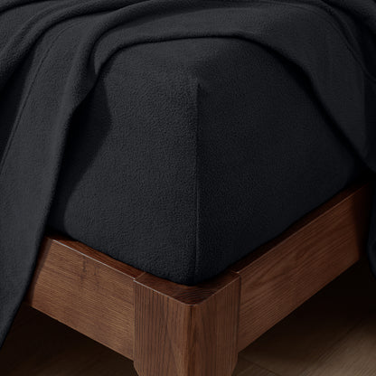 Fitted sheet on a wooden bed frame