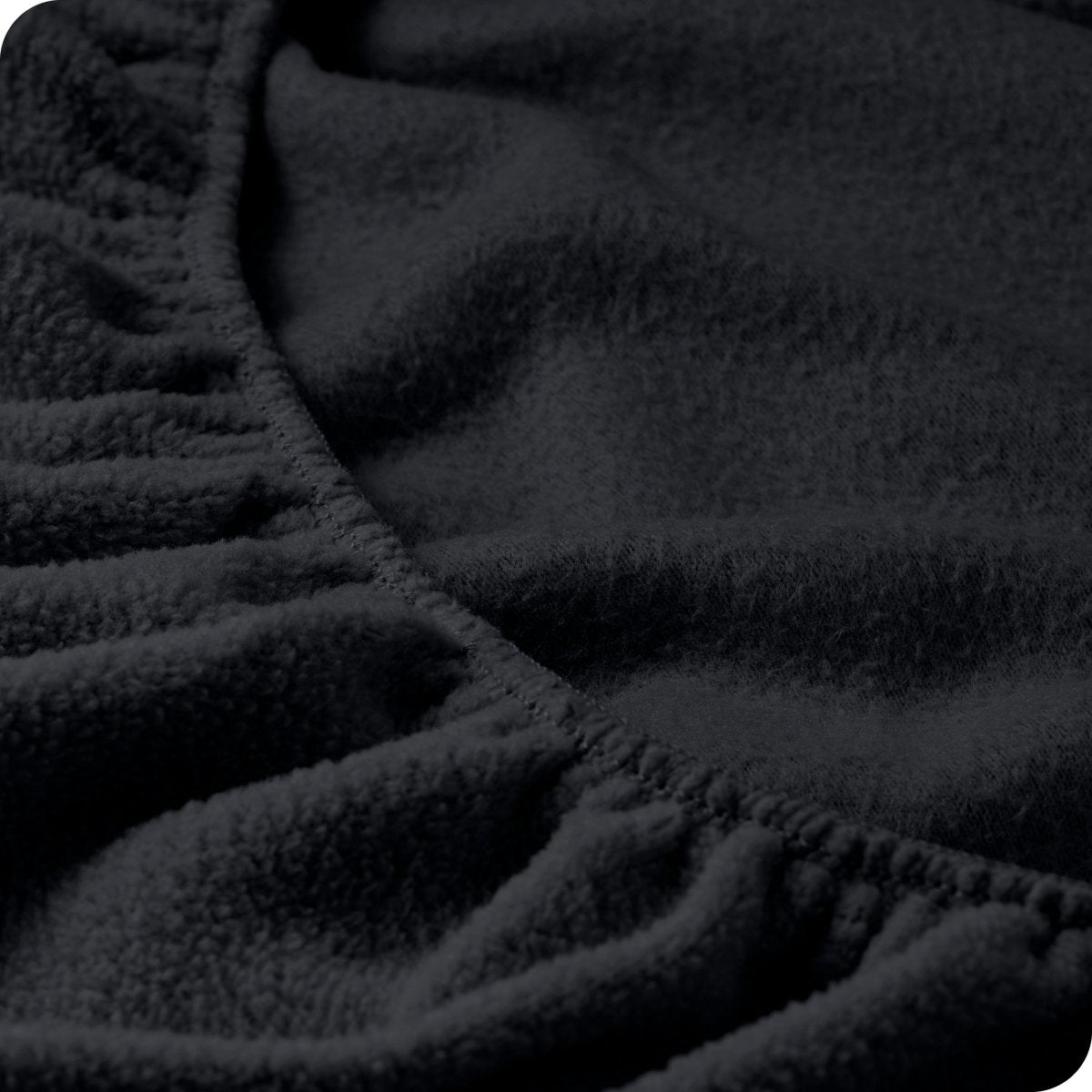 Close up of the elastic portion of a fleece fitted sheet