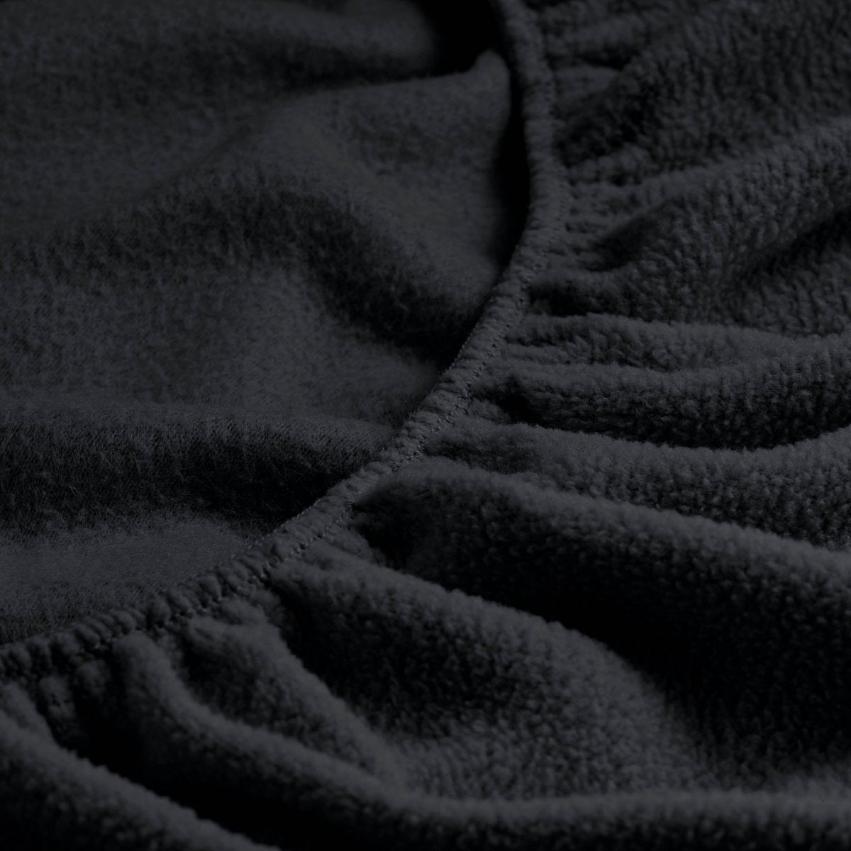 Close-up of a fitted sheet with all around elastic