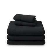 Polar fleece sheets and pillowcases folded and stacked on a white background