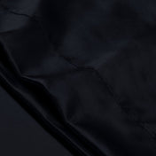 Close-up of the envelope closure on the satin pillowcase