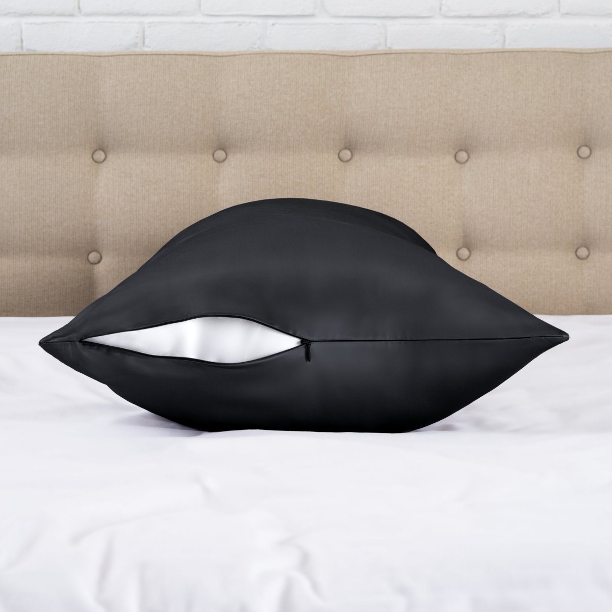 Zipper closure satin pillowcase on a bed