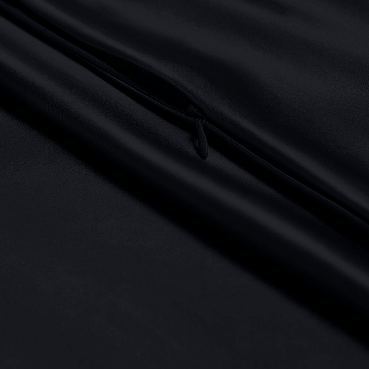 Close-up of a zipper closure on the satin pillowcase