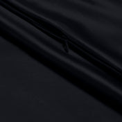 Close-up of a zipper closure on the satin pillowcase