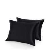 Two satin pillowcases on a white background