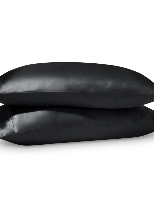 2 satin pillowcases on pillows stacked