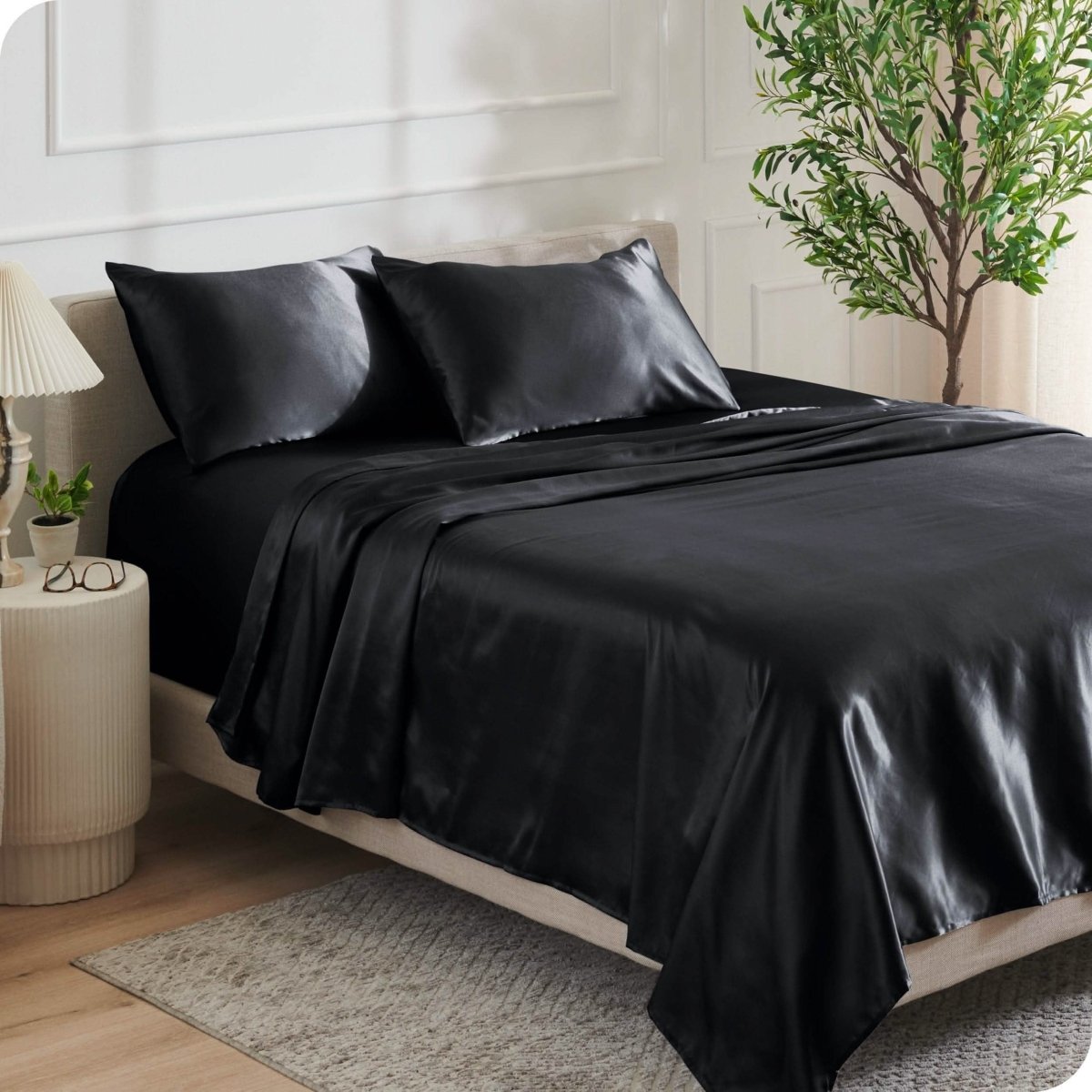Satin sheets on a bed